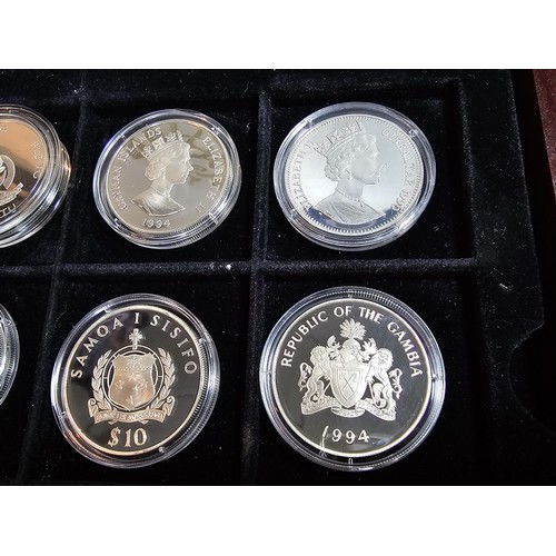 159 - A wooden cased collection of 12x solid silver proof coins, 11 are 1oz silver coins and 1 half ounce,... 