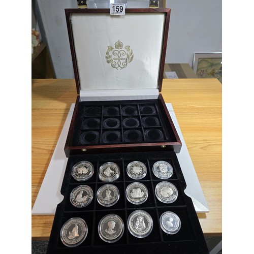 159 - A wooden cased collection of 12x solid silver proof coins, 11 are 1oz silver coins and 1 half ounce,... 