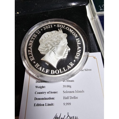 160 - A collection of 6 coins to include a Solomon island half dollar coin celebrating 95 years of Queen E... 