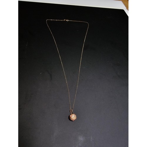 262 - A 9ct yellow gold necklace with a crystal ball pendant, in excellent clean condition and boxed. Tota... 