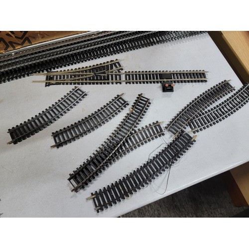 43 - Box containing a very large quantity of 'OO' gauge train track inc straights and curves