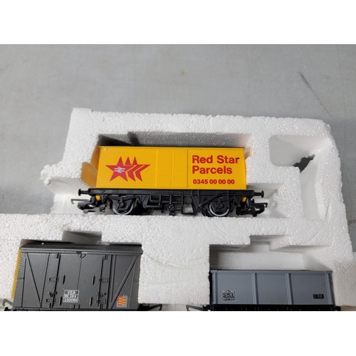 48 - Model Hornby train set stored in polystyrene - rolling stock inc Regent, shell, Red Star Parcels etc