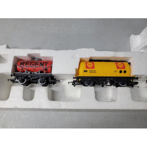 48 - Model Hornby train set stored in polystyrene - rolling stock inc Regent, shell, Red Star Parcels etc