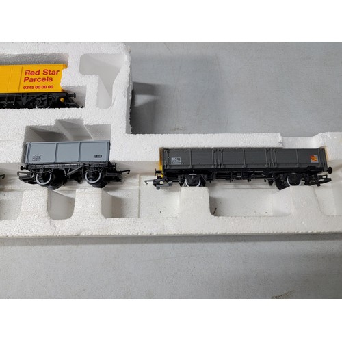 48 - Model Hornby train set stored in polystyrene - rolling stock inc Regent, shell, Red Star Parcels etc