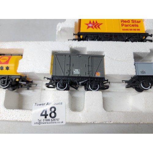 48 - Model Hornby train set stored in polystyrene - rolling stock inc Regent, shell, Red Star Parcels etc