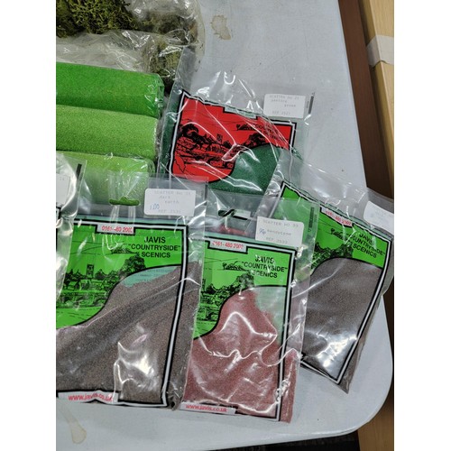 41 - Green tub of model railway countryside grass mats, trees and other foliage, most are sealed as new i... 