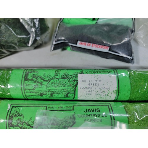 41 - Green tub of model railway countryside grass mats, trees and other foliage, most are sealed as new i... 