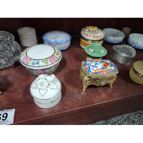 69 - A large quantity of ceramic and glass trinket boxes most with lids, inc sequin decorated trinket box... 