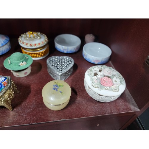 69 - A large quantity of ceramic and glass trinket boxes most with lids, inc sequin decorated trinket box... 