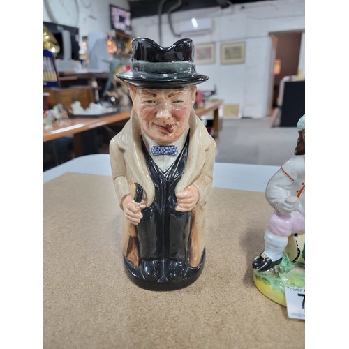 78 - A genuine antique Staffordshire figure 'The Jolly Farmer' sitting on a keg, along with a Royal Doult... 