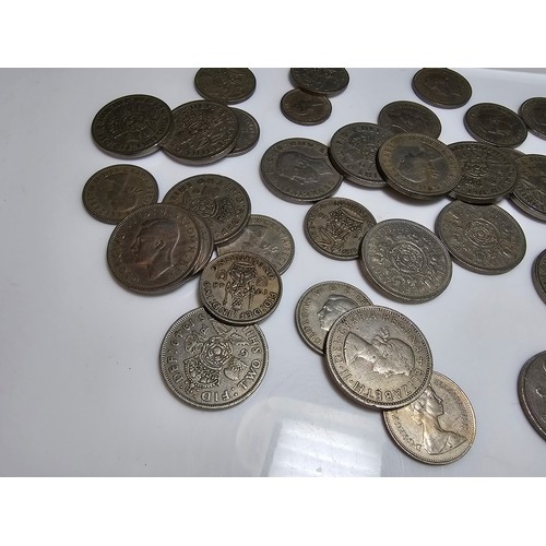 231 - a bag full of various vintage British one shilling and 2 shilling coins.