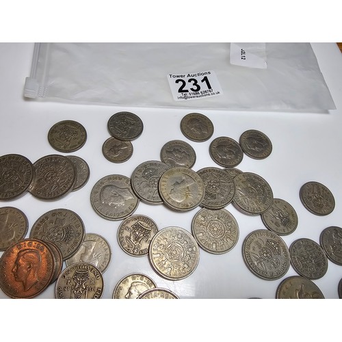 231 - a bag full of various vintage British one shilling and 2 shilling coins.