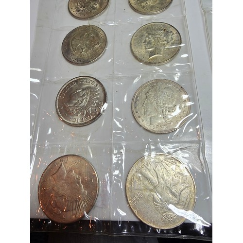 232 - A large collection of 48x reproduction novelty American coins ideal as coin fillers for coin albums.