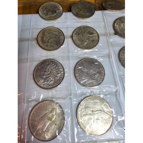 232 - A large collection of 48x reproduction novelty American coins ideal as coin fillers for coin albums.