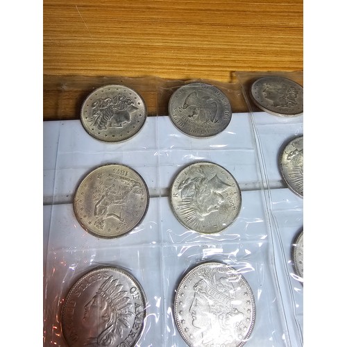 232 - A large collection of 48x reproduction novelty American coins ideal as coin fillers for coin albums.