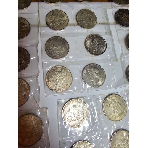 232 - A large collection of 48x reproduction novelty American coins ideal as coin fillers for coin albums.