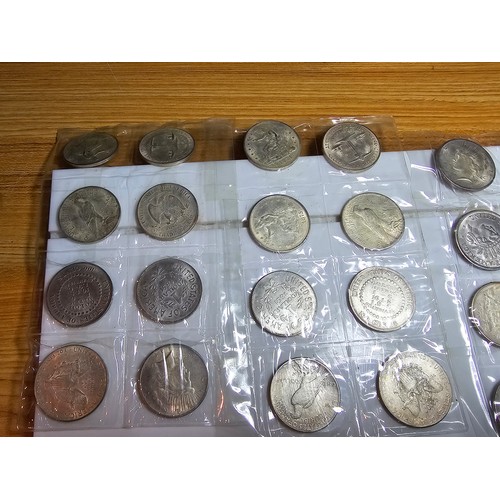 232 - A large collection of 48x reproduction novelty American coins ideal as coin fillers for coin albums.