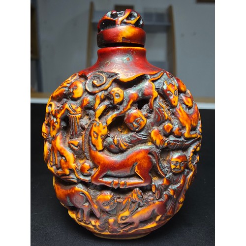 235 - A good vintage Chinese carved snuff bottle featuring intricate deep carved scene to the sides featur... 