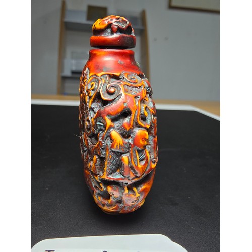 235 - A good vintage Chinese carved snuff bottle featuring intricate deep carved scene to the sides featur... 