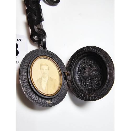 238 - A good Victorian Whitby jet mourning locket, beautifully carved to the front featuring a deep carved... 