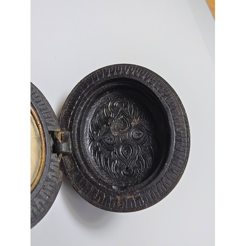 238 - A good Victorian Whitby jet mourning locket, beautifully carved to the front featuring a deep carved... 