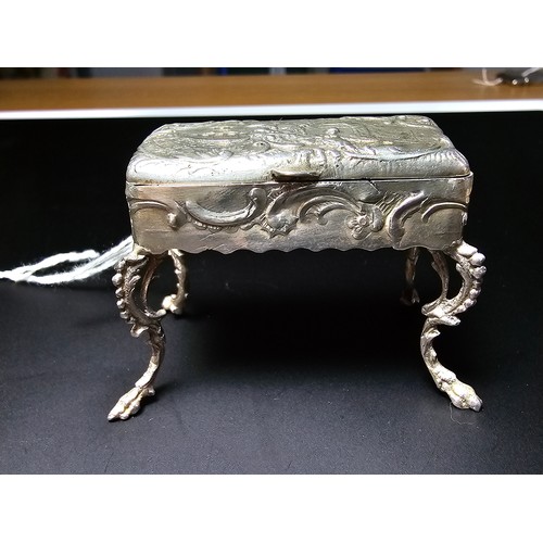 239 - Antique fine quality dutch sterling silver footed table snuff box of furniture form with an ornate e... 