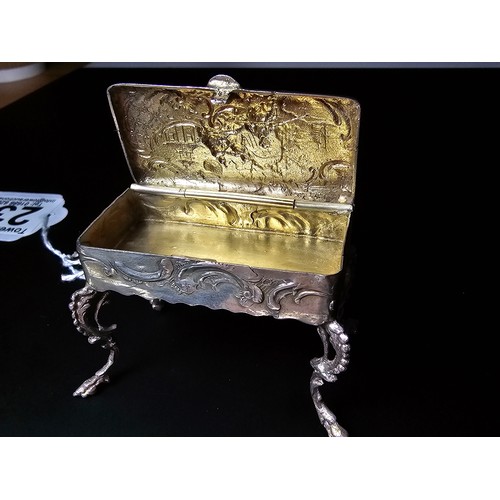 239 - Antique fine quality dutch sterling silver footed table snuff box of furniture form with an ornate e... 