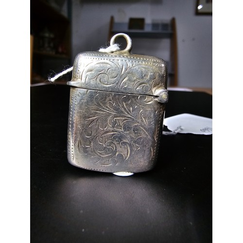 241 - A good quality antique hallmarked silver Vesta case with an engraved design to the front and back ha... 