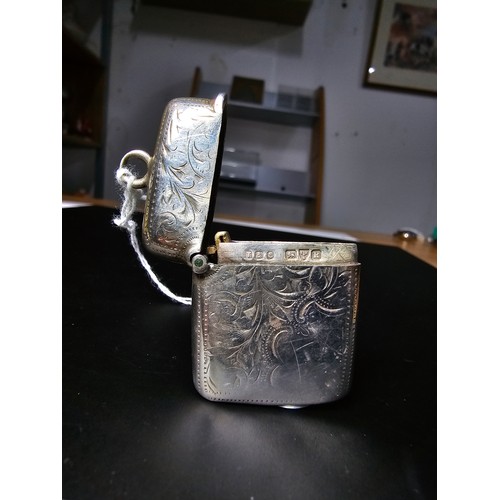 241 - A good quality antique hallmarked silver Vesta case with an engraved design to the front and back ha... 