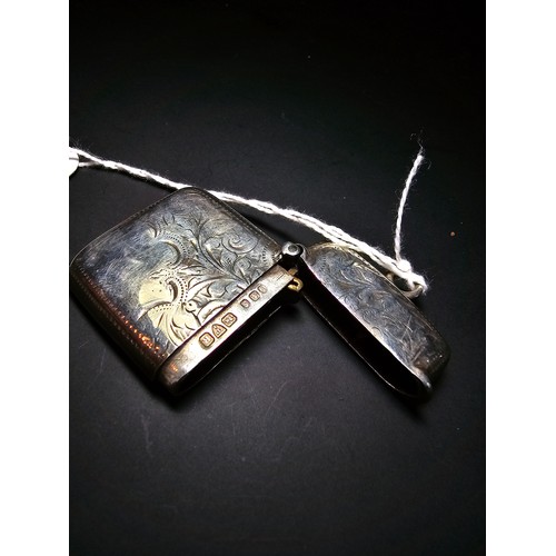 241 - A good quality antique hallmarked silver Vesta case with an engraved design to the front and back ha... 