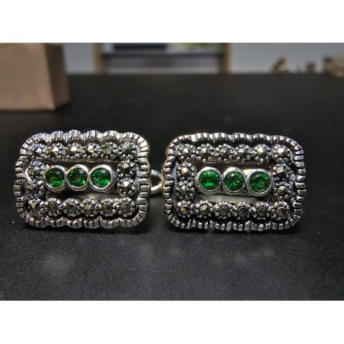 210 - Unused pair of stunning Art Deco style 925 silver earrings, inset with Marcasite stones and three vi... 