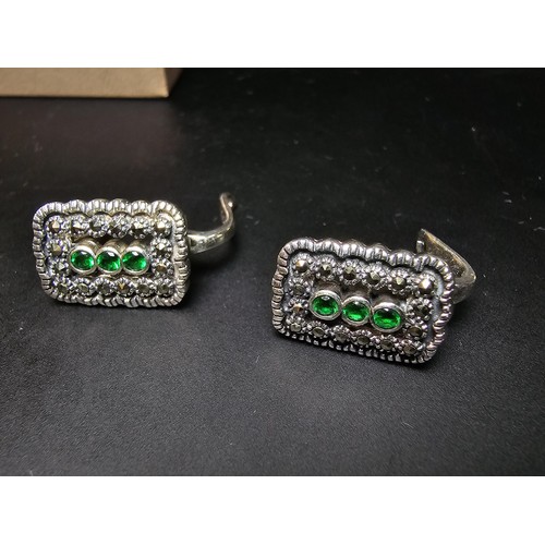 210 - Unused pair of stunning Art Deco style 925 silver earrings, inset with Marcasite stones and three vi... 