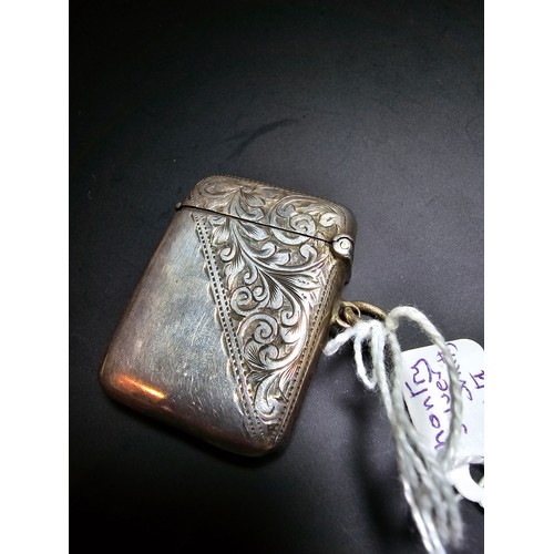 244 - Hallmarked silver vesta case with engraved design to the front and back in good condition hallmarked... 