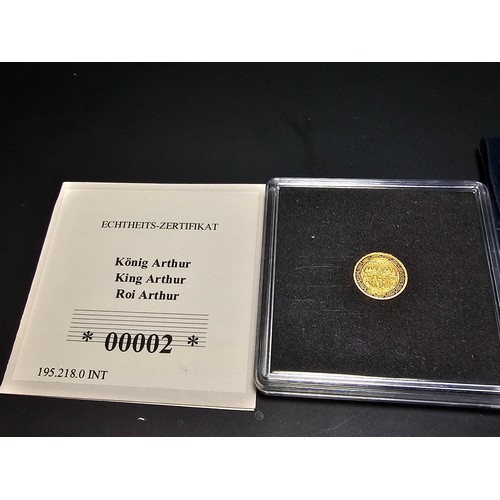 268 - A Westminster collection King Arthur 14ct solid gold proof coin, 2022 with a weight of 0.5g featurin... 