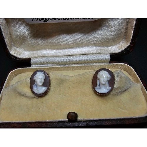 269 - A pair of good quality antique 14ct yellow gold cameo collar studs in original case  featuring a car... 