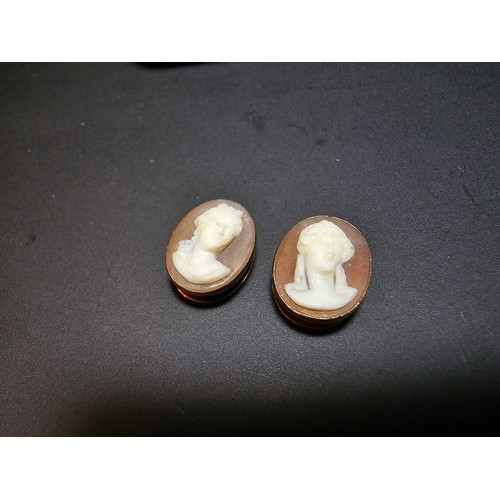 269 - A pair of good quality antique 14ct yellow gold cameo collar studs in original case  featuring a car... 