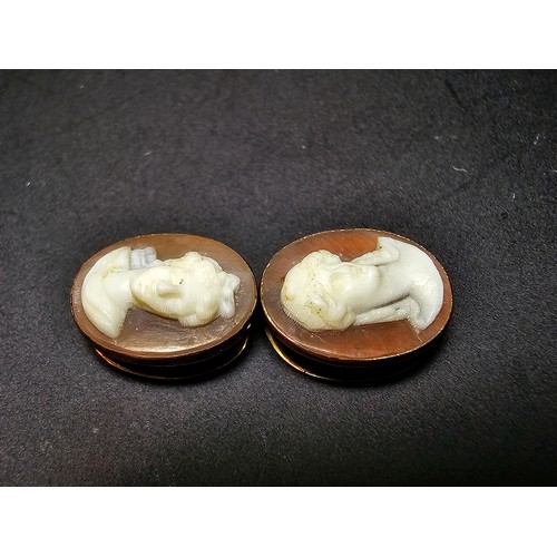 269 - A pair of good quality antique 14ct yellow gold cameo collar studs in original case  featuring a car... 