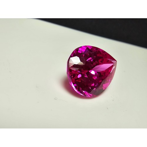 252 - A cased large lab created tear drop cut faceted pink sapphire gemstone complete with its presentatio... 