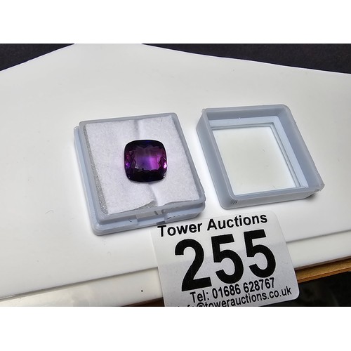 255 - A cased large lab created cushion cut faceted purple sapphire gemstone has a lovely blue to purple h... 