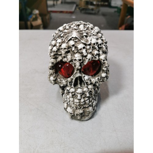 128 - Brand new resin ornate skull figure with light up heart eyes with original packaging. Battery operat... 