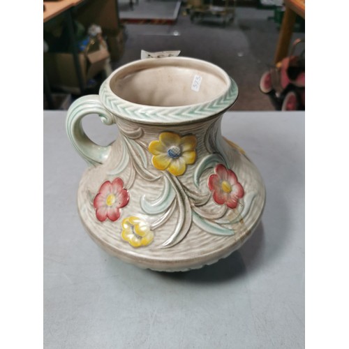 134 - H. J. Wood Ltd Burslem hand coloured jug with impressed floral pattern. Measures 21cm height. In goo... 