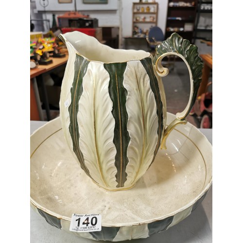 140 - Large impressive antique ceramic green and cream ewer & basin with an ornate raised leaf design. The... 