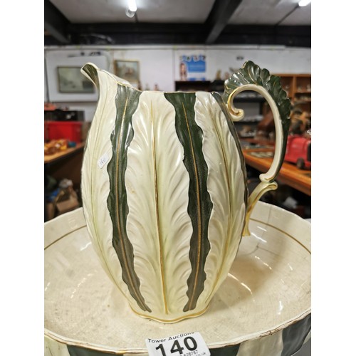 140 - Large impressive antique ceramic green and cream ewer & basin with an ornate raised leaf design. The... 