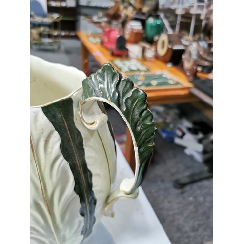 140 - Large impressive antique ceramic green and cream ewer & basin with an ornate raised leaf design. The... 