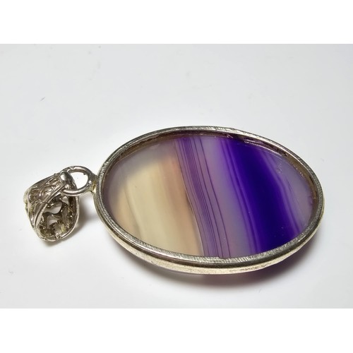 171 - A large 925 silver oval pendant inset with a  large natural agate stone with natural banding which i... 