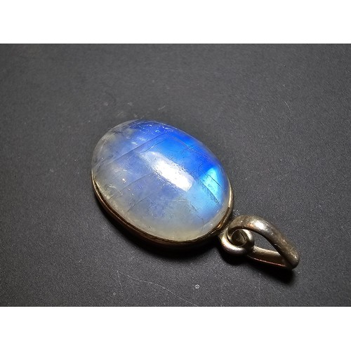 172 - A pair of pretty 925 silver pendants, 1 inset with a large oval rainbow moonstone which has beautifu... 