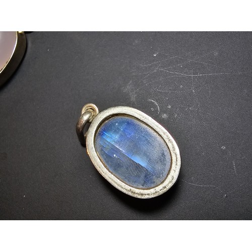 172 - A pair of pretty 925 silver pendants, 1 inset with a large oval rainbow moonstone which has beautifu... 