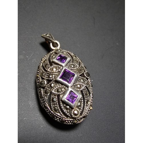 174 - A stunning art deco style hallmarked silver locket inset with 3 faceted genuine amethyst stones surr... 