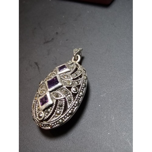 174 - A stunning art deco style hallmarked silver locket inset with 3 faceted genuine amethyst stones surr... 