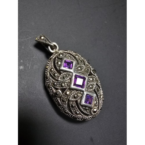 174 - A stunning art deco style hallmarked silver locket inset with 3 faceted genuine amethyst stones surr... 